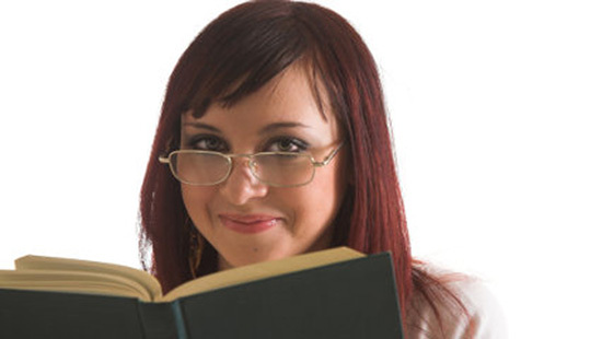 girl reading big books isolated on white